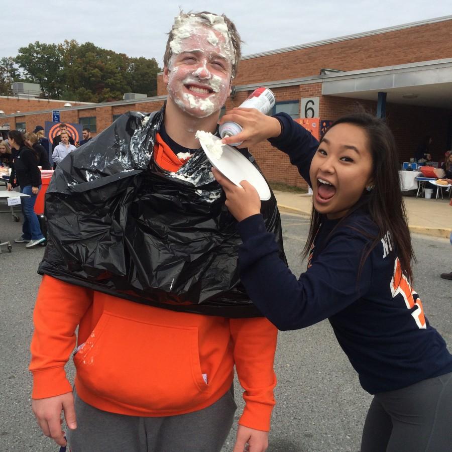 Seniors+Tommy+Howe+and+Cara+Kim+are+earning+money+for+the+Class+of+2016+by+throwing+pies+in+the+students%E2%80%99+faces+for+SpartanFest.