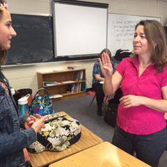 Junior Shelly Shoults chats with her teacher, Ms. Kendrick, through the use of American Sign Language she has learned in class.