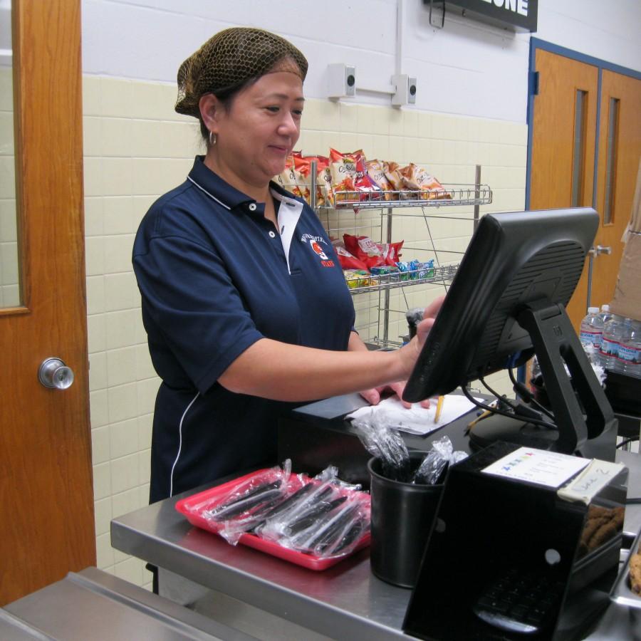 WS’s friendly cafeteria lunchlady handles the forks behind the counter to ensure that students who did not buy lunch properly pay the five cent fee for the bendy plastic utensil.