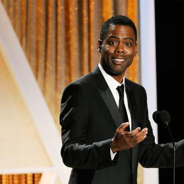 Actor/comedian Chris Rock addresses the audience during the 2014 Governors Awards on Saturday, Nov. 8, 2014, in Los Angeles. (Photo by Chris Pizzello/Invision/AP)