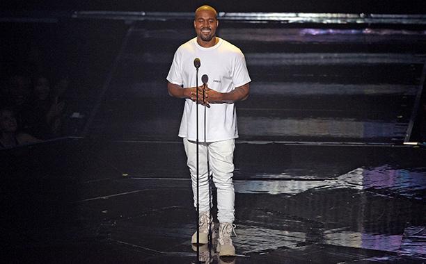 Here Kanye is giving a speech at the VMA awards while also promoting his clothing line. He is wearing his limited edition combat boots with his “famous” t-shirt.  