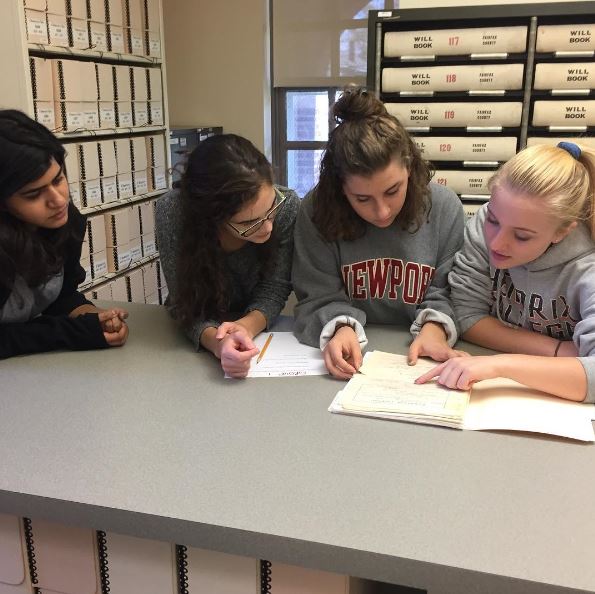 Applied History students dig through the pages of historical documents at the Fairfax Circuit Court Records Center