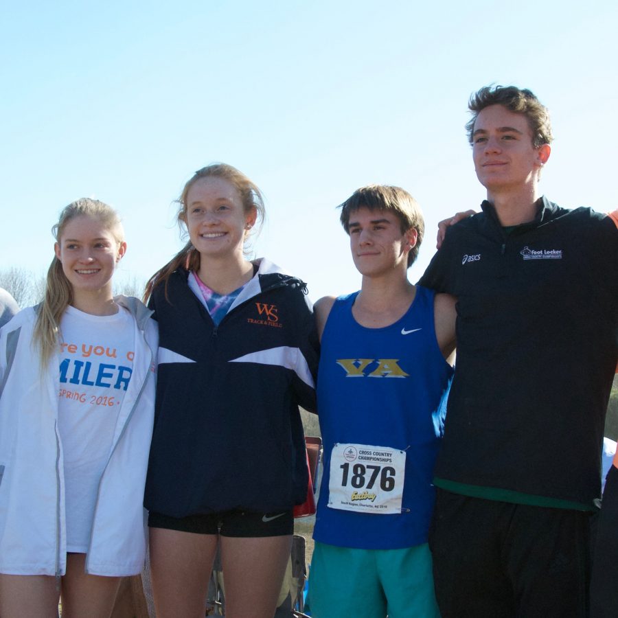 Cross+Country+Coach+Chris+Pelligrini+poses+proudly+with+Spartan+runners+who+participated+in+the+Footlocker+meet.