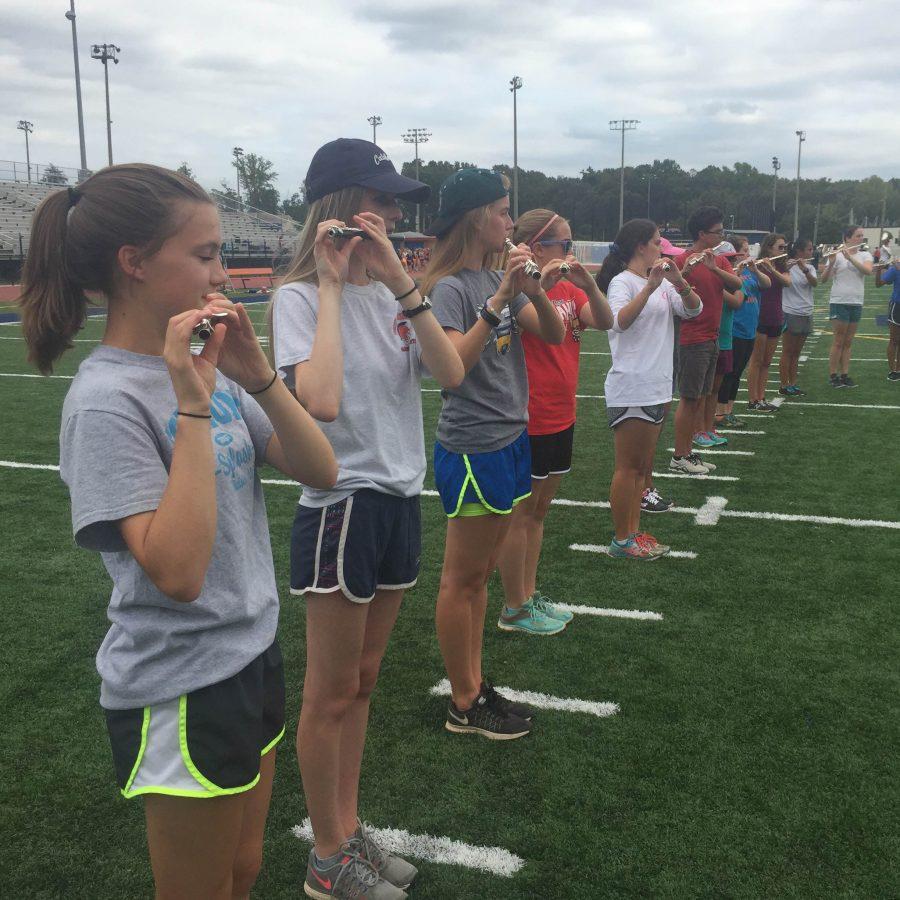 The marching Spartan flutes and piccolos practicing, to  get ready for football half-time shows, and their own competitions. 