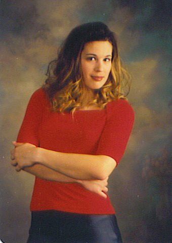 Stephanie Van posing for her school picture at her old high school, Turtle Mountain Community High School.