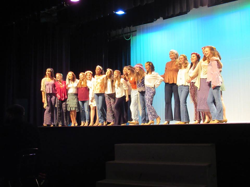 Personality Show Choir performs their opening number, “Aquarius/Let the Sun Shine In” on Thursday night.