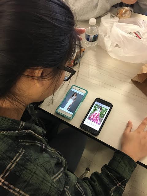 Minhtu Tran decides between two dresses for prom during her lunch. For many seniors, picking a Prom dress can be a long and difficult process.