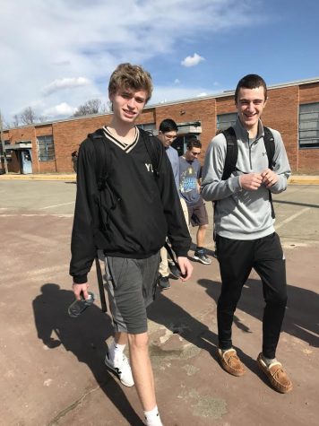 Juniors Sam Treasure and David Larsen walking to their class during one of the warm fronts.