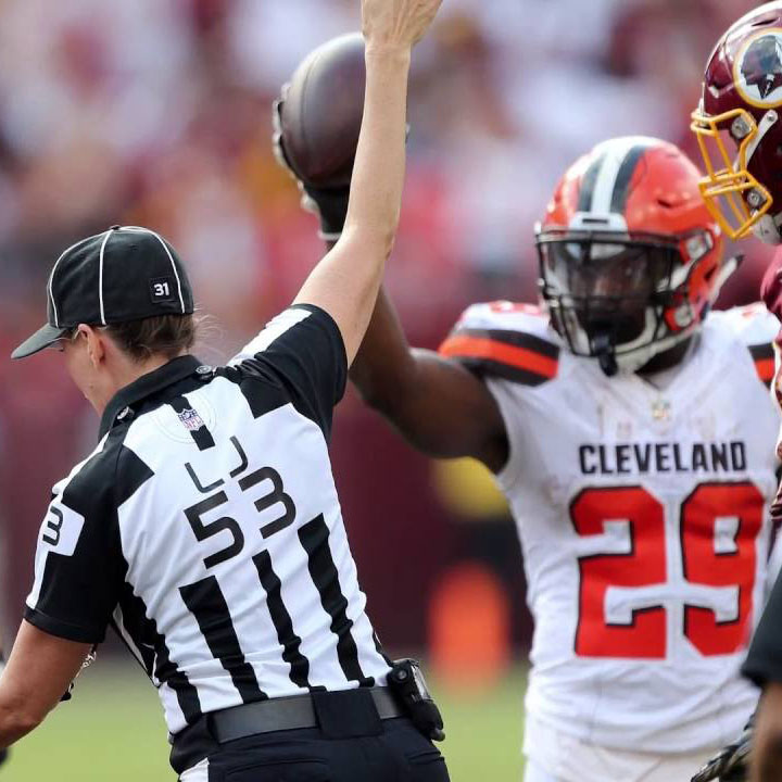 Cleveland Browns running back Duke Johnson showing the referee he has the ball.  Johnson recovered his own fumble in a game against the Redskins, but the referees gave the ball to the Redskins.
