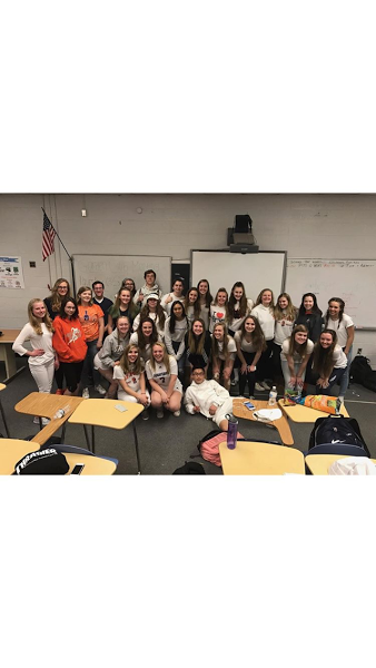 The WS Gardening Club members join together to take a group photo. Rebecca Geiger, one of the founders is kneeling to the left in the front, along side her co-founder Erika Parker, on the right.