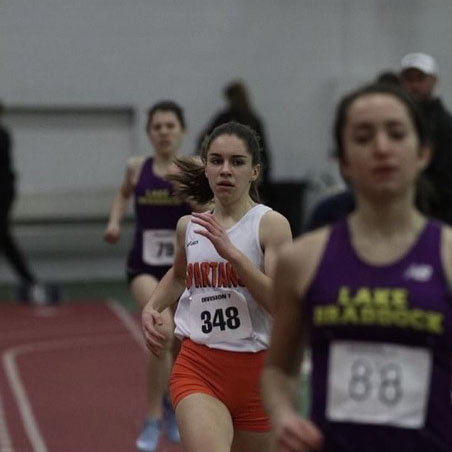 Rachel Mayberry runs her way around the track at NB Nationals.