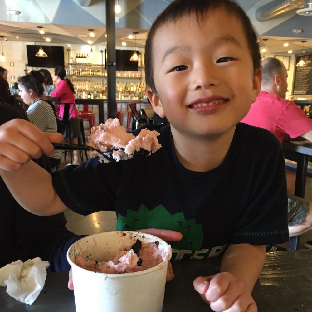 Future Spartan Mathew Thompson eats Strawberry Snowcream from Snowcream, one of the many vendors at the block. Snowcream sells sweet treats in an a variety of different flavors. Among these treats are their Boba tea and Snocream.