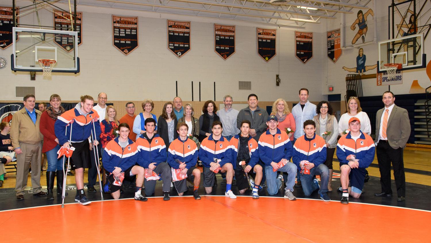 The senior class of the wrestling team before their final home competition. The seniors led the wrestling team to a 6-1 conference record and two of the three Spartan wrestlers who went to the state tournament were seniors.