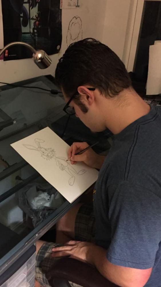 Niko Porter, WS freshman, sketches a picture of a rabbit, Frank, for his next cartoon. He uses these sketches to help him draw the character accurately.