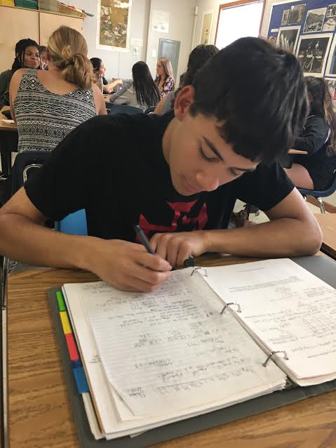 Senior Paul Hughs works diligently as he prepares for his upcoming AP exam. He, along with other WS students, is excited to continue learning after tests end.