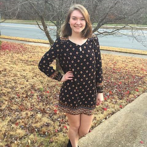 Junior Molly Haynes poses in a dress that she wore on a day in December to show her participation in the Dressember campaign. This is a way for people to raise awareness about human traficking and unethical labor practices. 