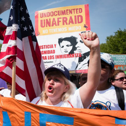 Protester defends undocumented children that were protected under the DACA  act. 