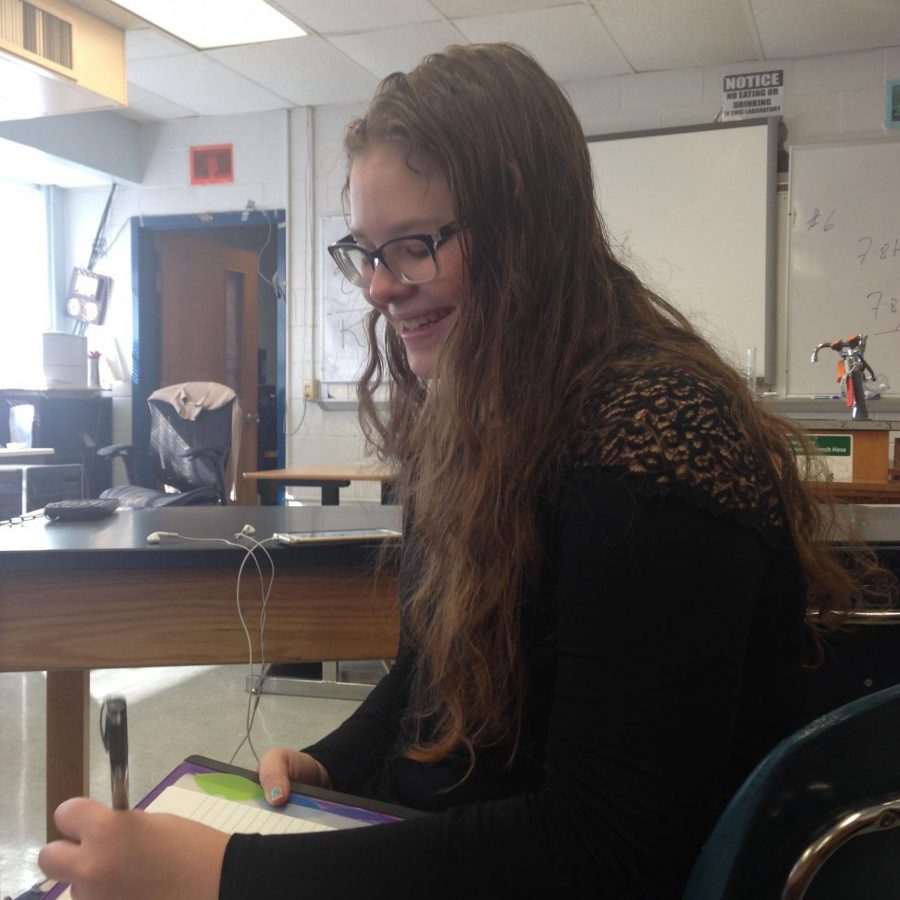 Junior Annika Sypher happily doing work in her Probability Statistics class.