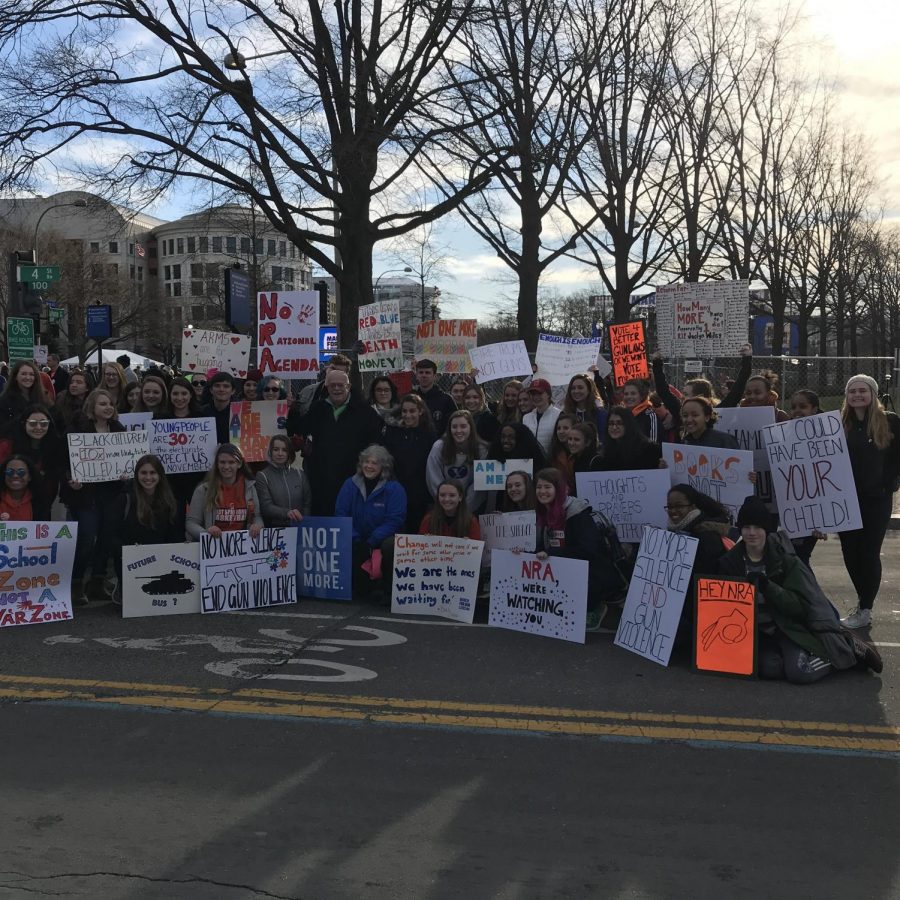 WS students stand together at the March for Our Lives holding signs that express their discontent for the current gun laws in the country.