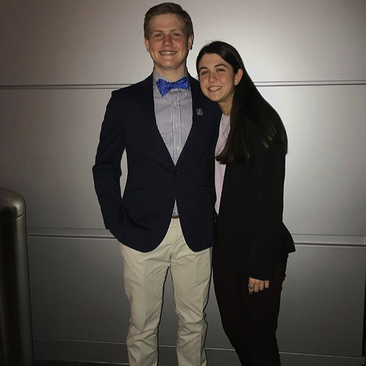 Junior Logan Parker and senior Diana Criste pose for a photo at the DECA competition at the Virginia Beach Convention Center.