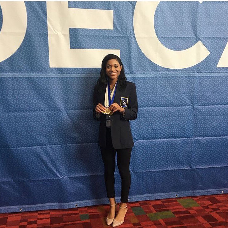 Junior Kareese Akinloba poses after placing in the top ten in the international DECA competition.