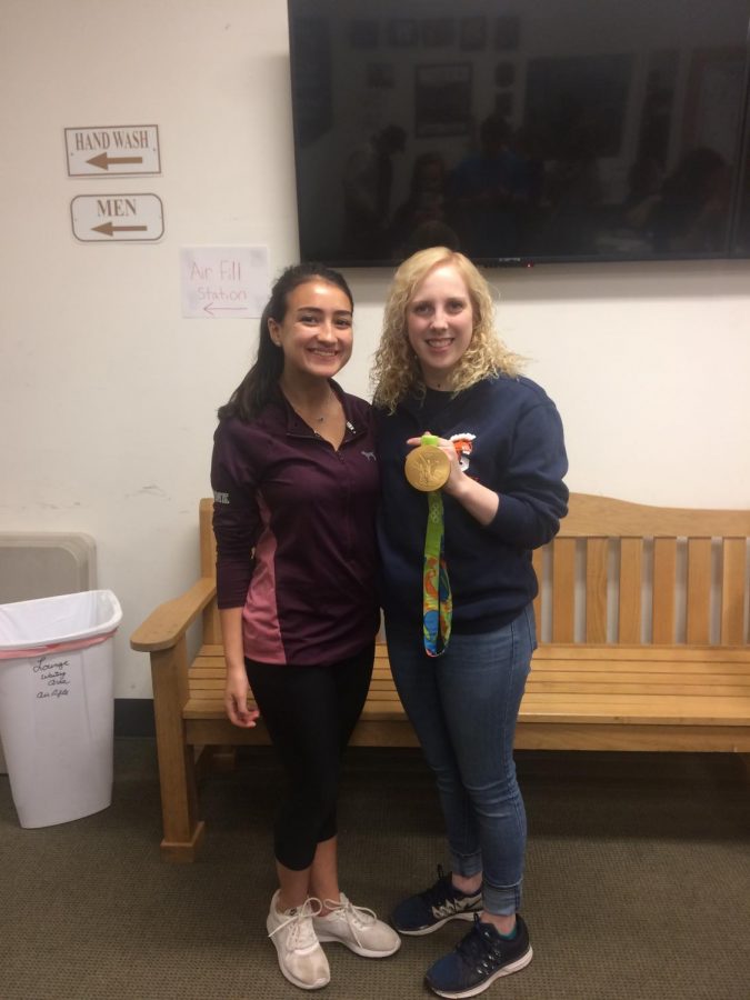 Junior Lauren Gagliano poses with Ginny Thrasher, who shows off her gold medal for air rifle. Thrasher is a WS alumnus and won their first medal of the 2016 games.