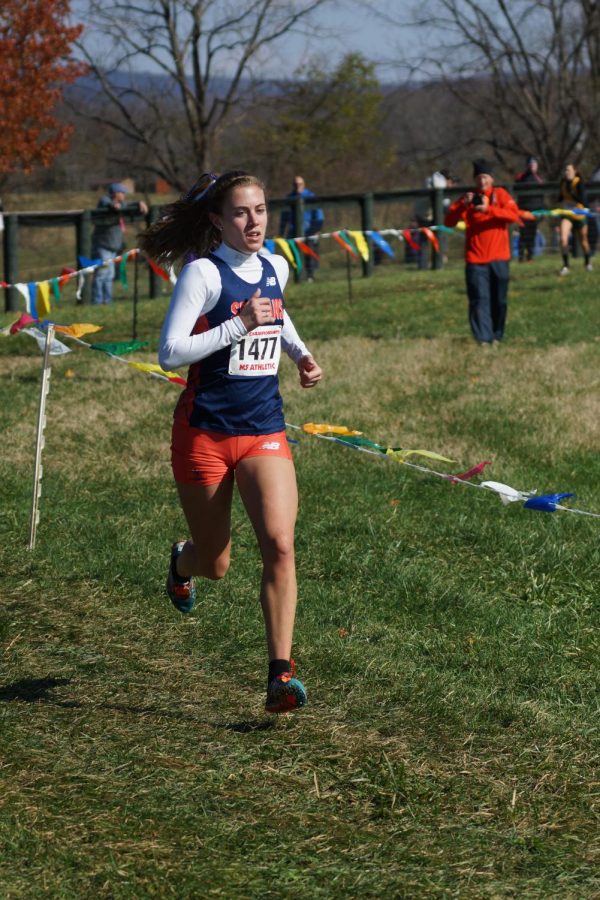 Chase Kappler battles her competitors in the girls Cross-Country race at States in Great Meadows, VA. She ended up finishing second in the state after an impressive performance throughout the race.