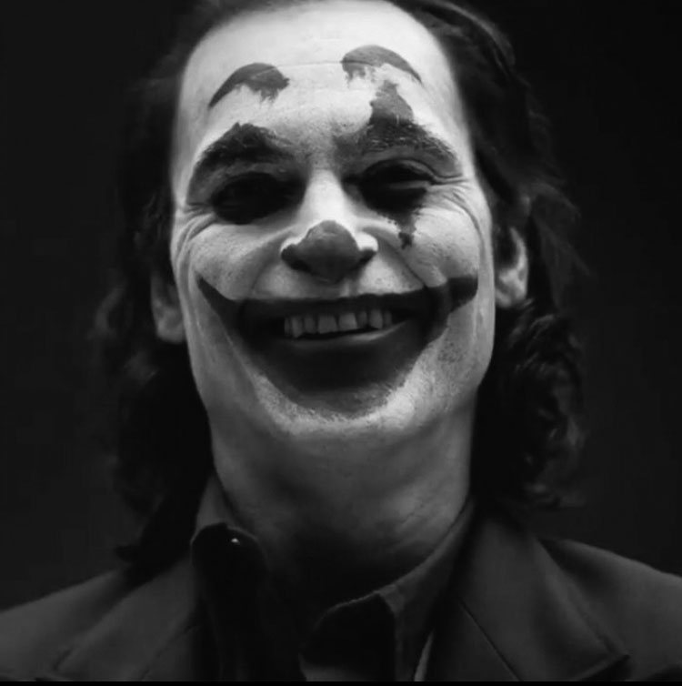 Joaquin Phoenix in makeup as the Joker in a teaser from the director of the movie. Many actors have played the role with different styles over the years.