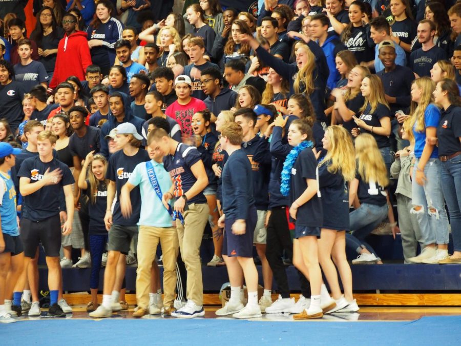 Seniors yell at the Homecoming pep rally; that yelling occasionally took the form of booing. 