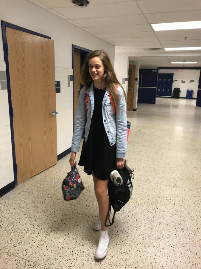 Prior to receiving a hall locker, sophomore Anna Pepper leaves an honor society meeting carrying her gym clothes.