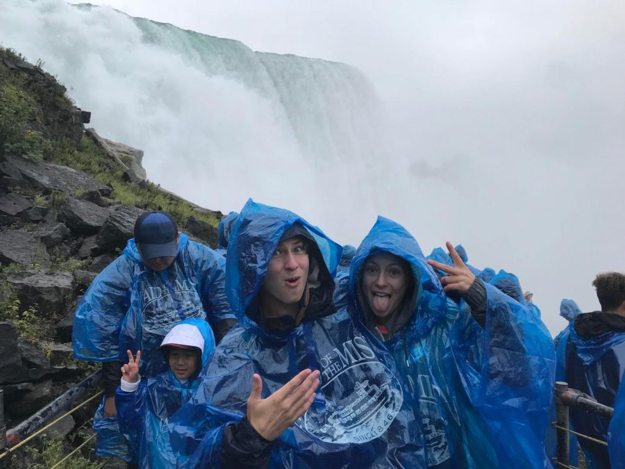 Cross country runners Sean Stuck and Amy Herrema clown around at Niagra Falls. They went to McQuaid Invitational in New York in late September. Some runners missed the Homecoming dance to compete in Rochester instead.
