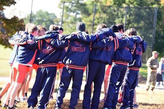 The Boys XC team huddles to prepare for regionals. They would take a commanding victory in the meet and would move on to place 2nd in States. 