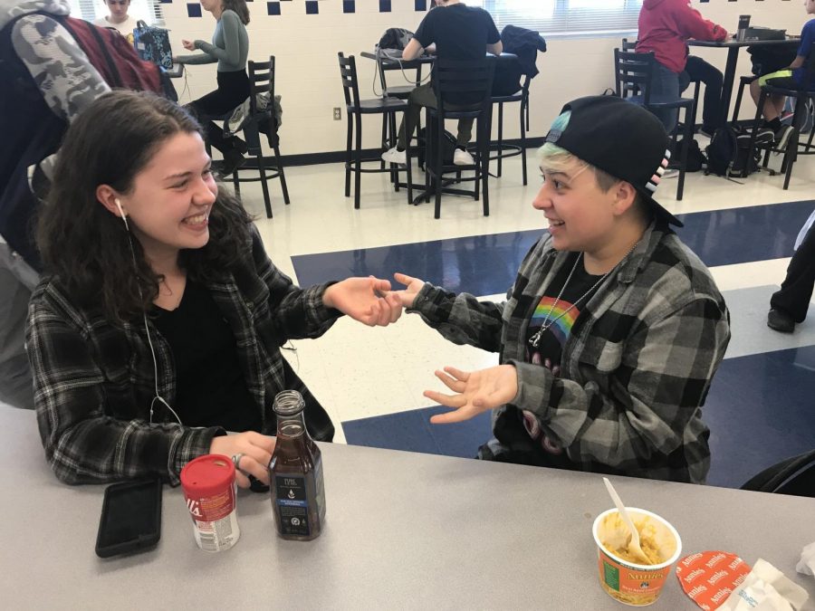 Seniors Sydney Anderson and Charlie Peterson chat at lunch about upcoming GSA meetings and recent developments from the FCPS School Board on the topic of gender inclusivity.