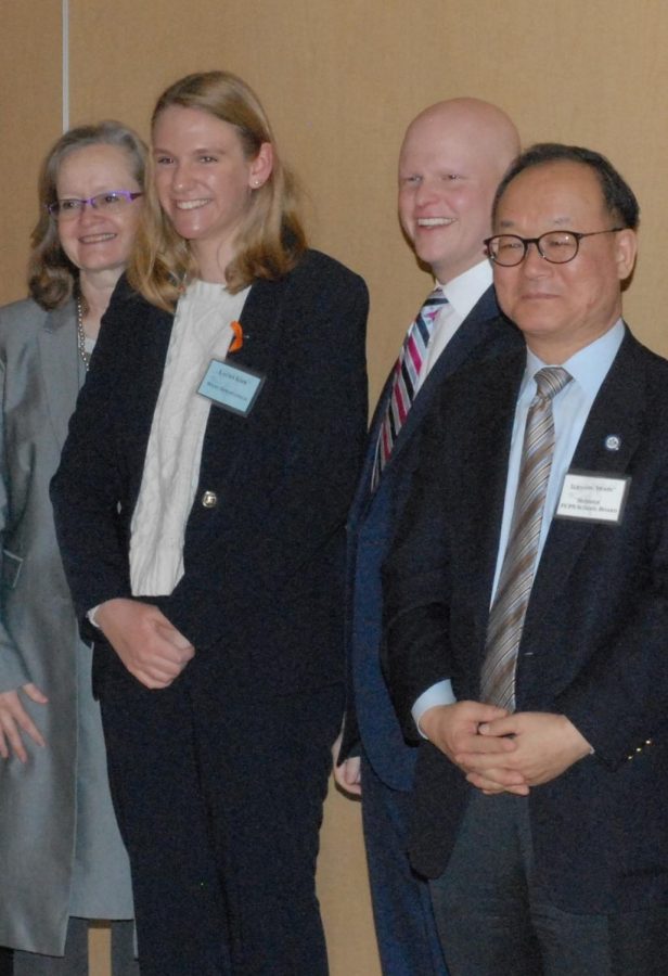 Karen+Corbett+Sanders%2C+Chair+of+the+FCPS+School+Board%2C+and+Peace+Award+winner+Laura+Kirk.+Here+Laura+is+accepting+her+award+at+the+Fairfax+County+Student+Peace+Award+ceremony%2C+which+took+place+on+March+10th.%0A