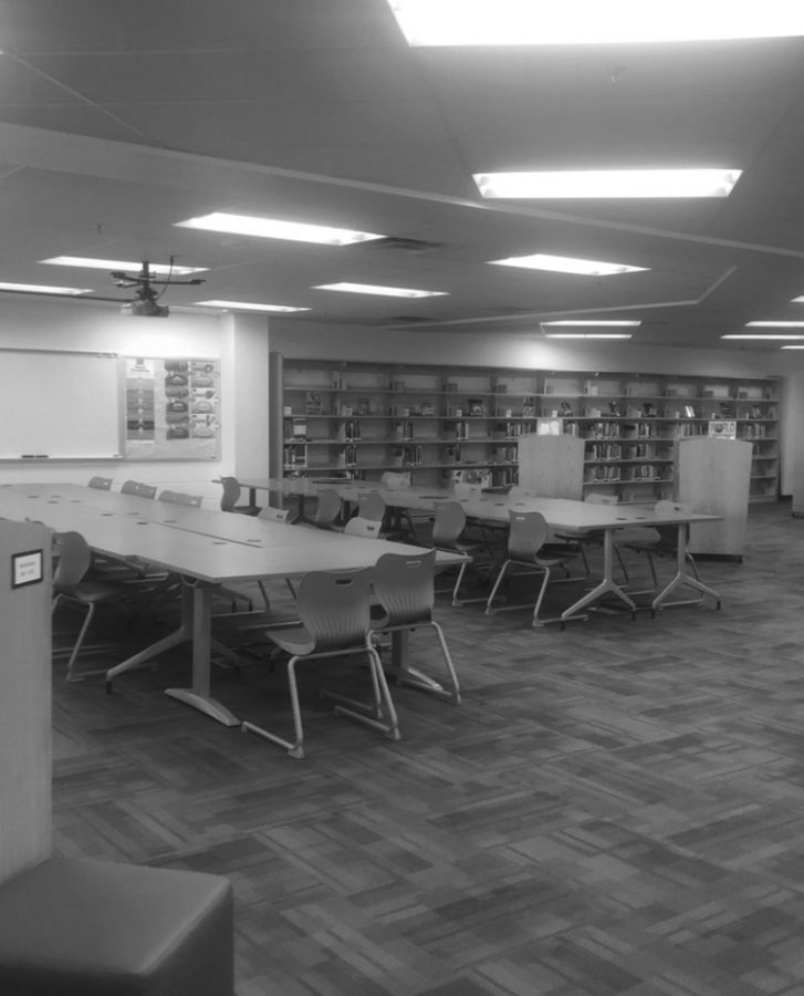 The FCPSON program removed most of the computers from WS. Here, library tables that used to have desktops sit unoccupied. Students have been advised to charge and bring their laptop, because the library is no longer a backup.