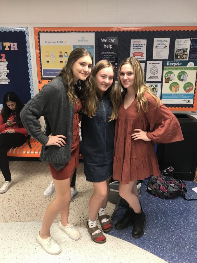 Freshmen Emma Jury, Nora Hennessy, and Helen Phillips wearing dresses to help end human trafficking in society.