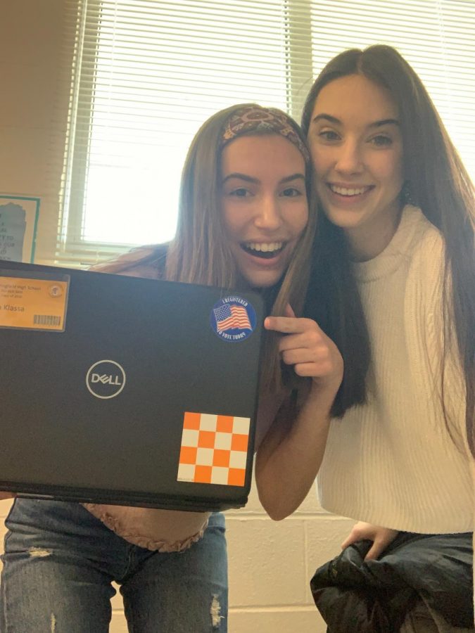 Seniors Mia Klassa and Natalie Points pose with their I Registered to Vote Today sticker after being registered in their government classes.