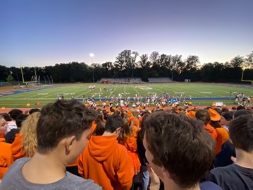 Students dress up in orange in support of WS at the homecoming football game versus Oakton, another mark of the return of school spirit events.