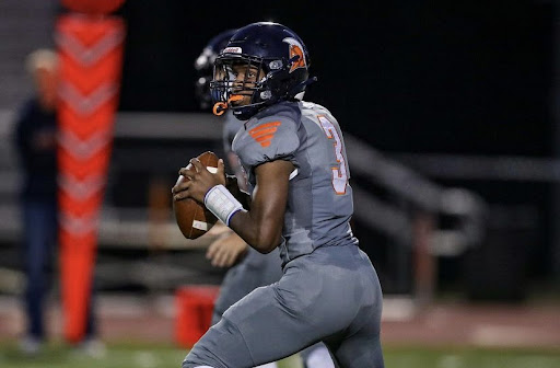 Manny Baskerville plays quarterback in place of the injured Adrian Mejia during the Homecoming game against Oakton. Mejia is one of many athletes across the sports world who has fallen plague to injury this year, as the wave of injuries is affecting not only the rest of high school athletics, but college and professional sports as well.