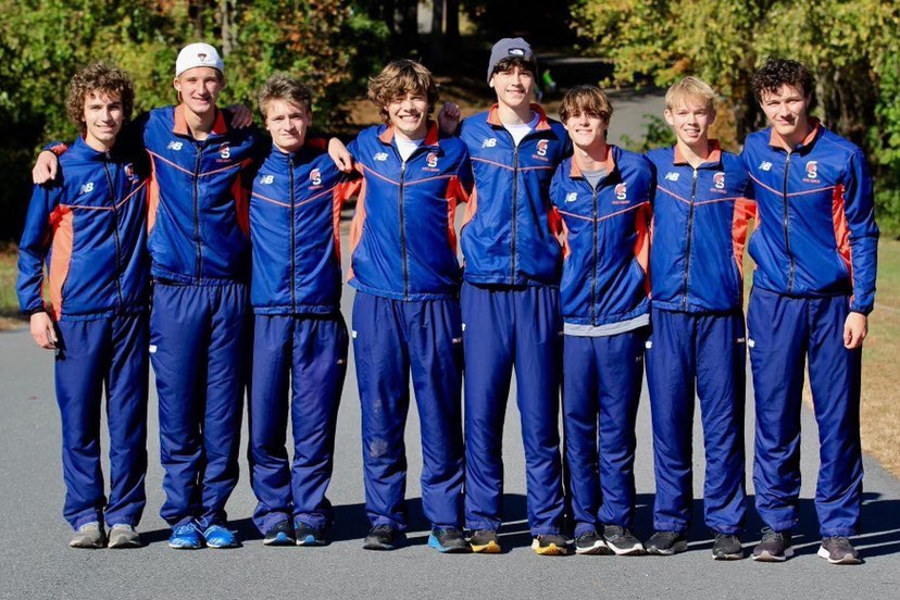 The Boys Cross Country team posing at Regionals. They swept first place at District and Regionals this year, powered primarily by the efforts of their senior runners.