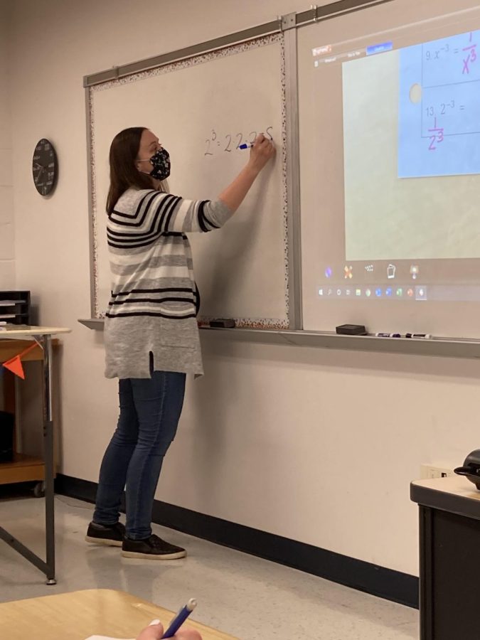 Teacher Erin Pawlowicz teaches a class of Algebra 1 students how to multiply exponents. Combined with the effects of virtual learning, an accelerated curriculum compared to last year, and the nature of math as a subject, this year has been difficult for many students.