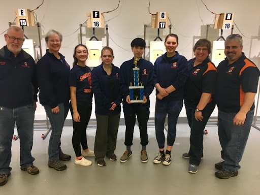Pictured above is the rifle team after they won the Regional Championships in the Potomac Rifle high school league. It was the highest honor of the season and Val Thrasher was a part of the coaching staff.