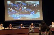 Sophomore Ishi Velpula stands before the meeting of FCPS board members to advocate for menstrual products in middle and high school bathrooms.