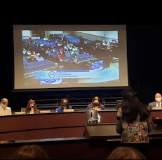 Sophomore Ishi Velpula stands before the meeting of FCPS board members to advocate for menstrual products in middle and high school bathrooms.