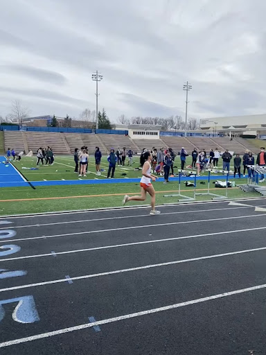 Freshman Jodie Weeks finishing up her race at the January 20 quad meet. She began running during quarantine and is now part of the Junior Varsity track team.