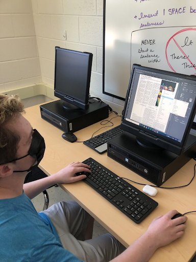 Sophomore Staff Writer Ben Bradfield works through the process of page design in InDesign.
