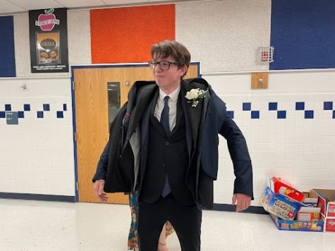 Pictured above is student Alex, who partook in a quest to see how many suit jackets he could wear.