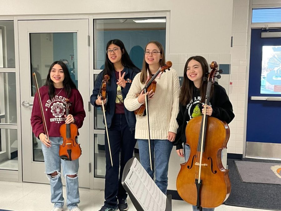 Tri-M members senior Tatiana Mancilla, junior Crystal Kitburi, senior Aila Koch, and senior Kanna Yerks (as seen from left to right) pose for an audience after receiving rounds of applause for their moving performance.