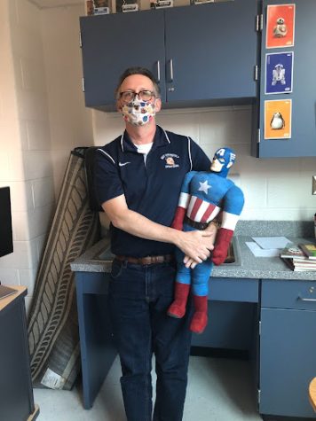 English teacher Kevin Deliee, who believes Iron Man was the winner of “Captain America: Civil War,” poses with Captain America.