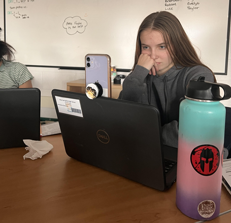 Senior EmmaLia Ciccarello in class having to login again after the site crashed. Ticketmaster’s parent company, Live Nation, is now under investigation by the Justice Department after reports of abusing its power over the live music industry came into question.